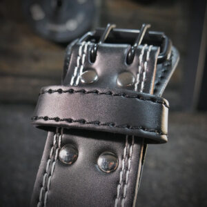 Close up of the RPM Power metal weightlifting belt buckle