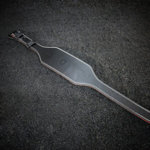 The HomeFlex belt outstretched on black carpet