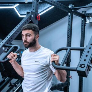 Man with Jammer Arms Pair Exercising on Power Rack