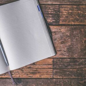 A journal notebook and pen on a table