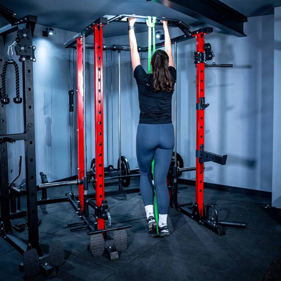 Woman using Power Rack with Smith Bar