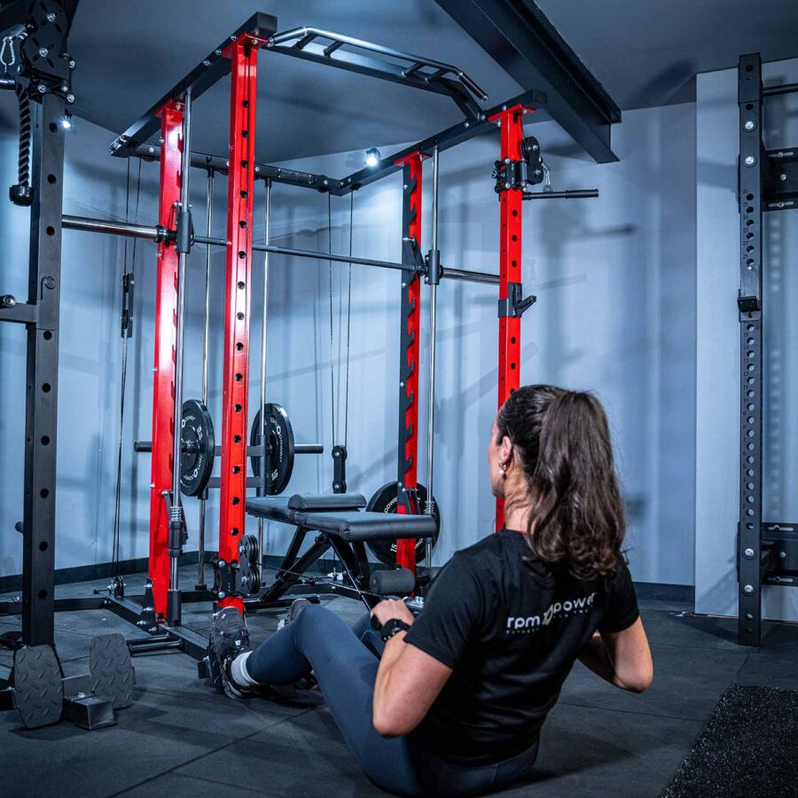Woman using Power Rack with Smith Bar